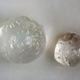 A pair of microtektites found inside ancient clam shells.